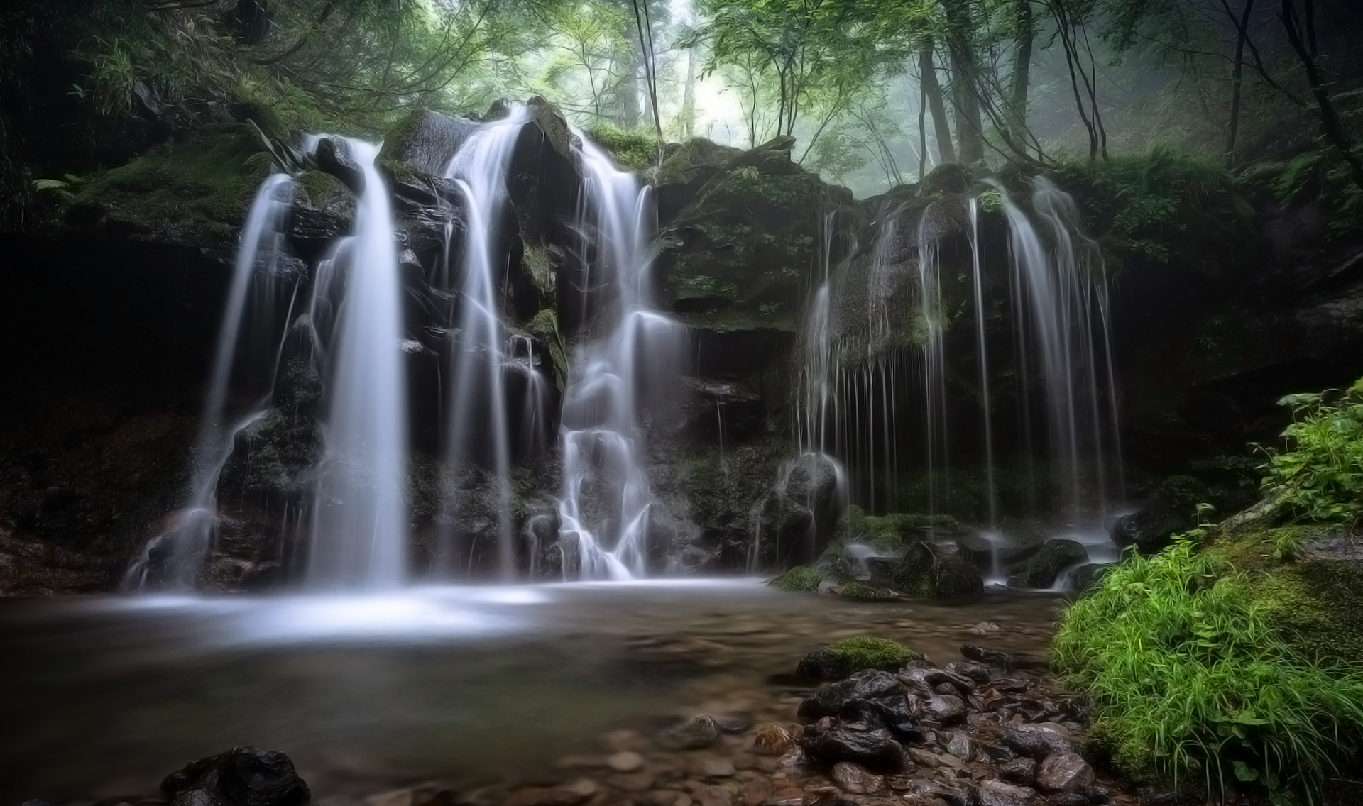 EXT. MEDIUM FOREST WATERFALL – DAY